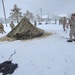 Airmen learn to build Arctic 10-person tents during cold-weather training at Fort McCoy