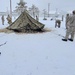 Airmen learn to build Arctic 10-person tents during cold-weather training at Fort McCoy