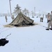 Airmen learn to build Arctic 10-person tents during cold-weather training at Fort McCoy