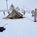 Airmen learn to build Arctic 10-person tents during cold-weather training at Fort McCoy