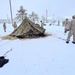 Airmen learn to build Arctic 10-person tents during cold-weather training at Fort McCoy