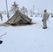 Airmen learn to build Arctic 10-person tents during cold-weather training at Fort McCoy