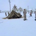 Airmen learn to build Arctic 10-person tents during cold-weather training at Fort McCoy