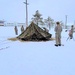 Airmen learn to build Arctic 10-person tents during cold-weather training at Fort McCoy