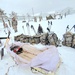 Airmen learn to build Arctic 10-person tents during cold-weather training at Fort McCoy