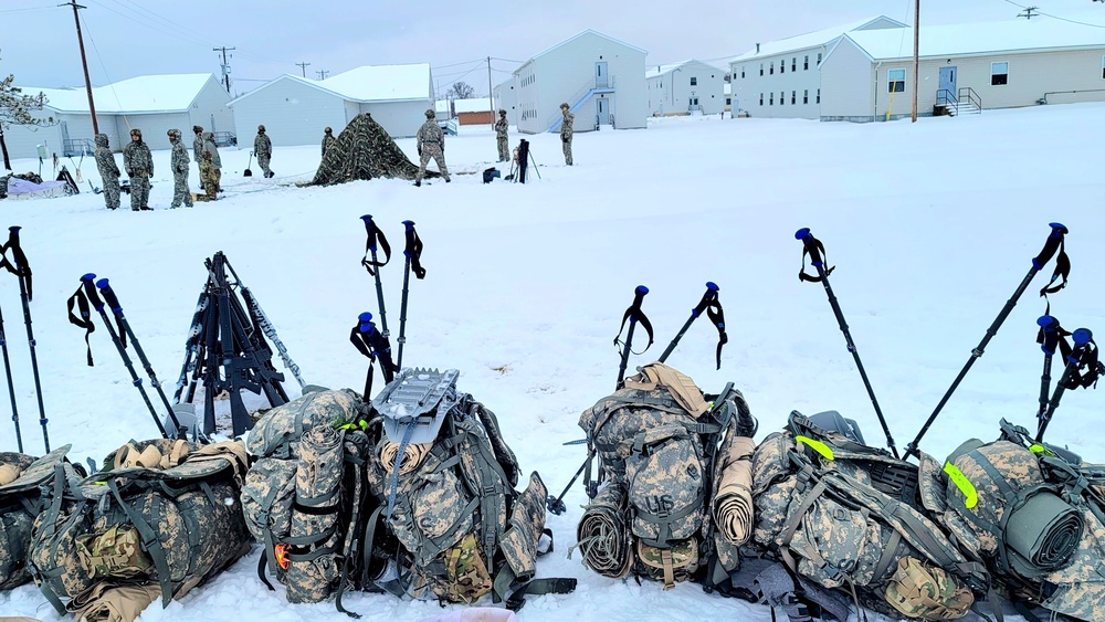 Airmen learn to build Arctic 10-person tents during cold-weather training at Fort McCoy