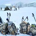 Airmen learn to build Arctic 10-person tents during cold-weather training at Fort McCoy