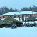 Airmen learn to build Arctic 10-person tents during cold-weather training at Fort McCoy