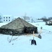 Airmen learn to build Arctic 10-person tents during cold-weather training at Fort McCoy