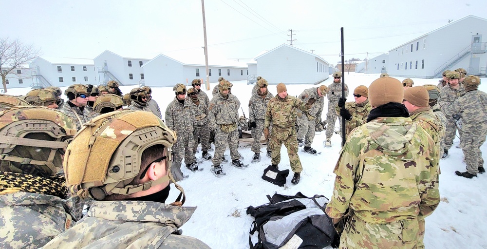 Airmen learn to build Arctic 10-person tents during cold-weather training at Fort McCoy