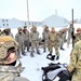 Airmen learn to build Arctic 10-person tents during cold-weather training at Fort McCoy