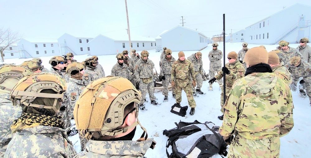 Airmen learn to build Arctic 10-person tents during cold-weather training at Fort McCoy