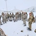 Airmen learn to build Arctic 10-person tents during cold-weather training at Fort McCoy