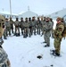 Airmen learn to build Arctic 10-person tents during cold-weather training at Fort McCoy