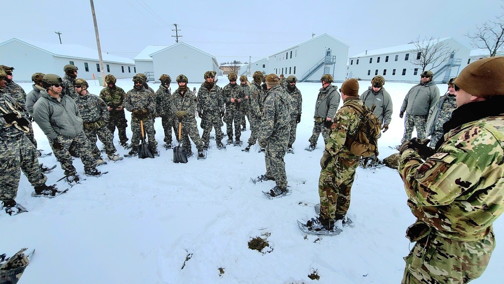 Airmen learn to build Arctic 10-person tents during cold-weather training at Fort McCoy