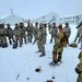 Airmen learn to build Arctic 10-person tents during cold-weather training at Fort McCoy