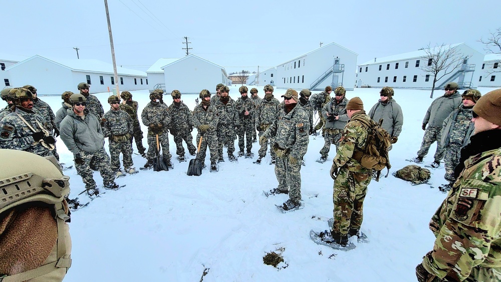 Airmen learn to build Arctic 10-person tents during cold-weather training at Fort McCoy