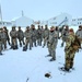 Airmen learn to build Arctic 10-person tents during cold-weather training at Fort McCoy