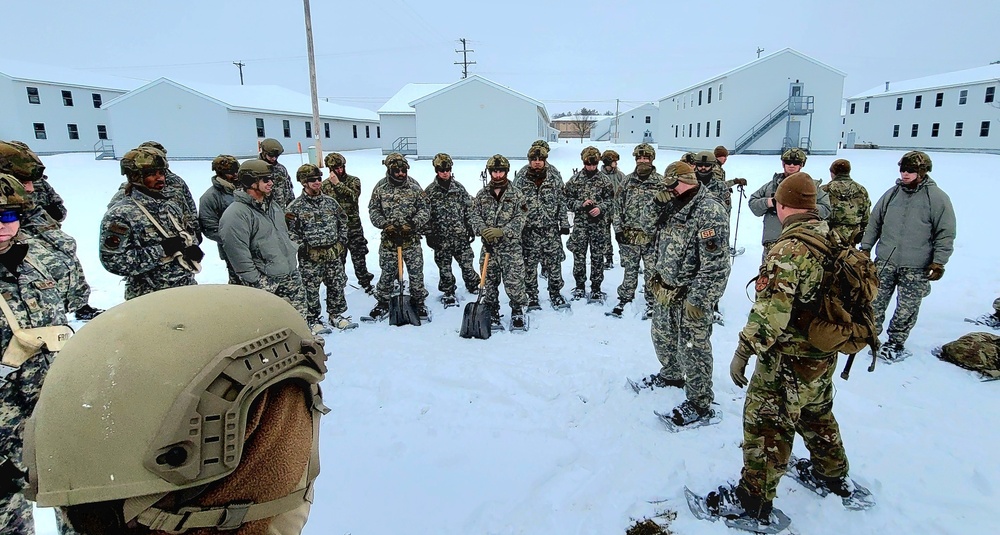 Airmen learn to build Arctic 10-person tents during cold-weather training at Fort McCoy