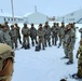 Airmen learn to build Arctic 10-person tents during cold-weather training at Fort McCoy