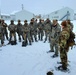 Airmen learn to build Arctic 10-person tents during cold-weather training at Fort McCoy