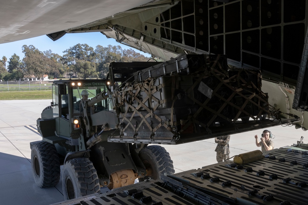 Marine Light Attack and Utility Helicopters Demonstrate Joint Expeditionary Capabilities with Air Force Transport Aircraft