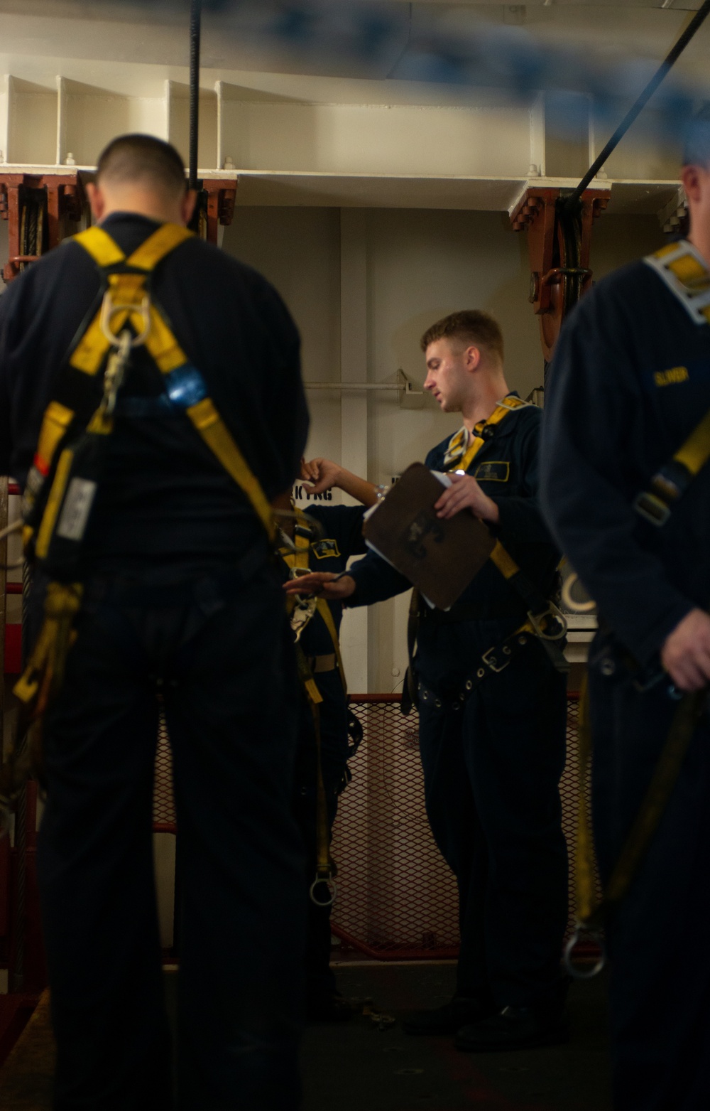 Sailors Conduct Inspection On A Weapons Elevator
