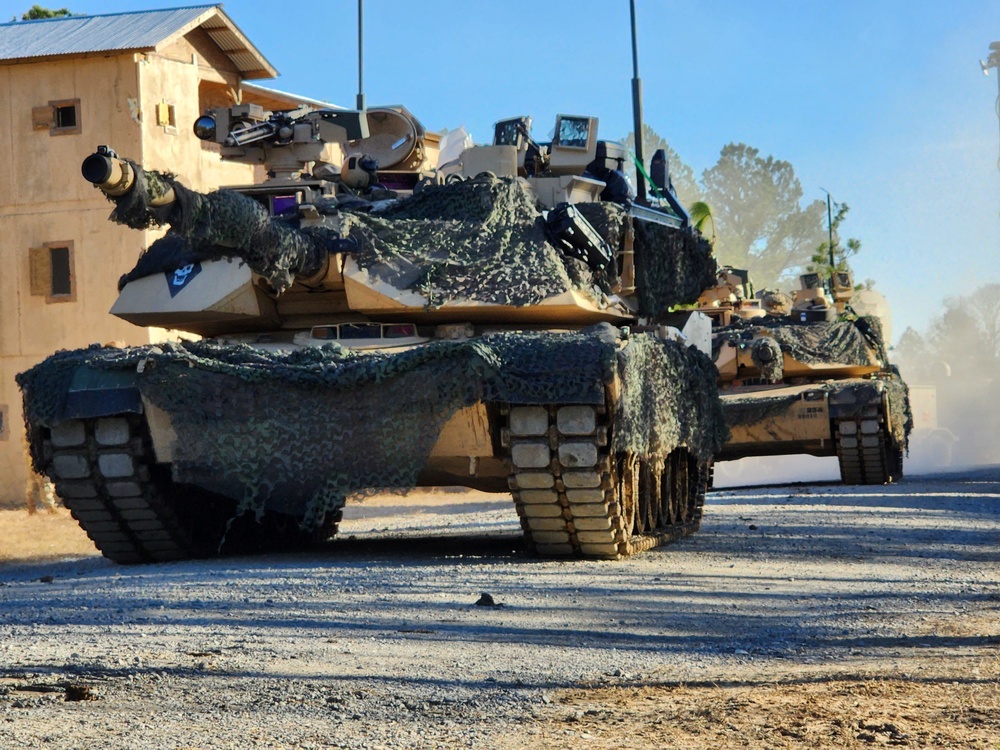 Tanks from the 1st Battalion, 37th Armored Regiment train at the Joint Readiness Training Center