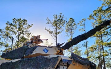 Tanks from the 1st Battalion, 37th Armored Regiment train at the Joint Readiness Training Center