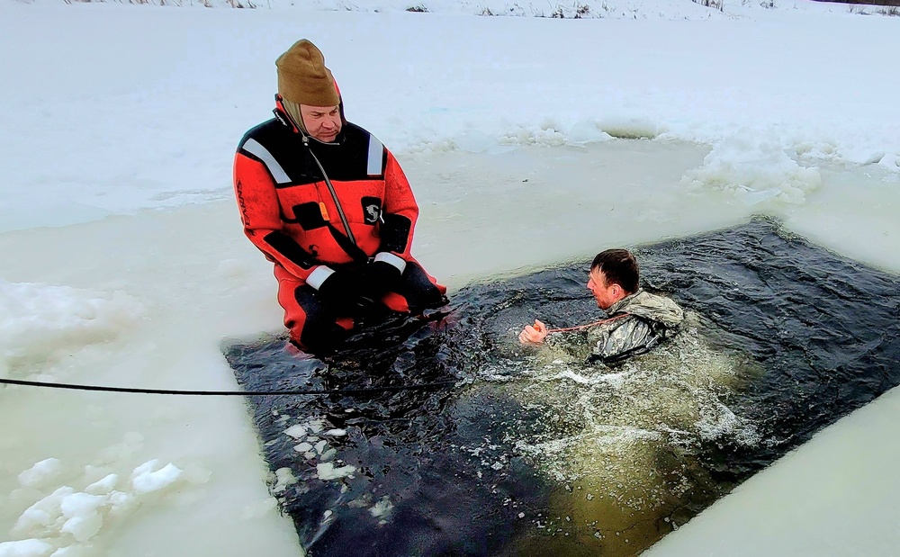 Airmen jump in for cold-water immersion training as part of Air Force-led Cold-Weather Operations Course at Fort McCoy