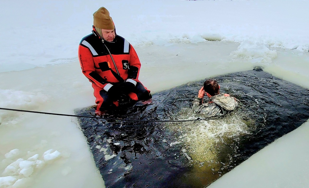 Airmen jump in for cold-water immersion training as part of Air Force-led Cold-Weather Operations Course at Fort McCoy