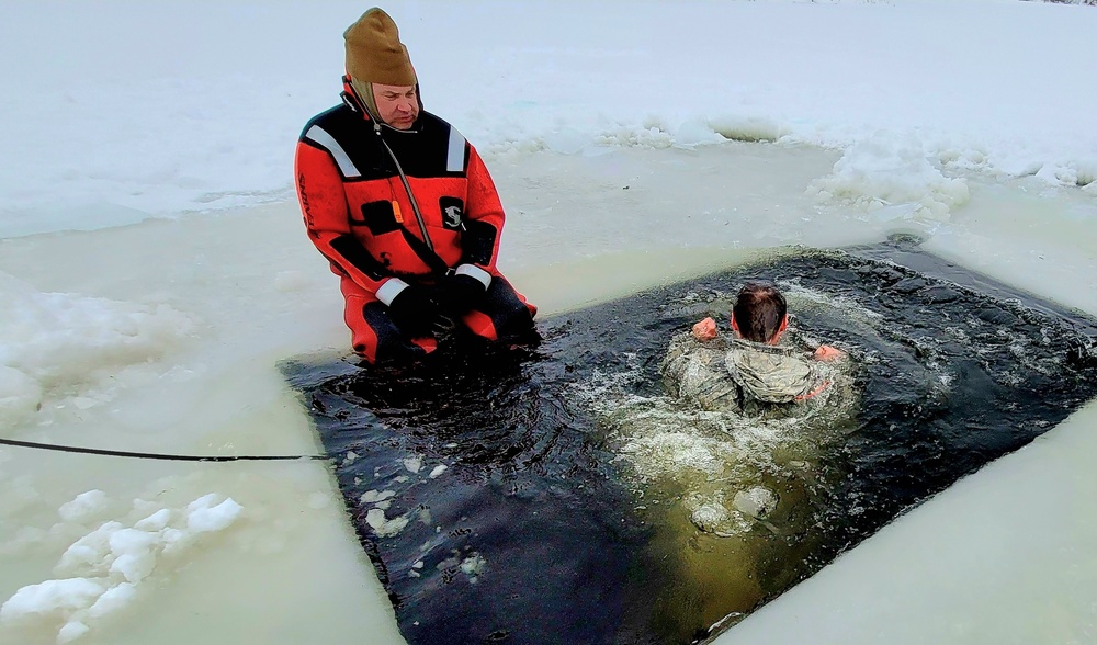 Airmen jump in for cold-water immersion training as part of Air Force-led Cold-Weather Operations Course at Fort McCoy