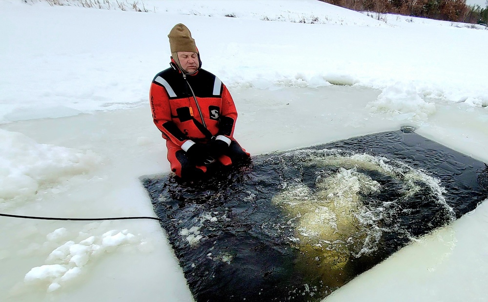 Airmen jump in for cold-water immersion training as part of Air Force-led Cold-Weather Operations Course at Fort McCoy