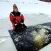 Airmen jump in for cold-water immersion training as part of Air Force-led Cold-Weather Operations Course at Fort McCoy