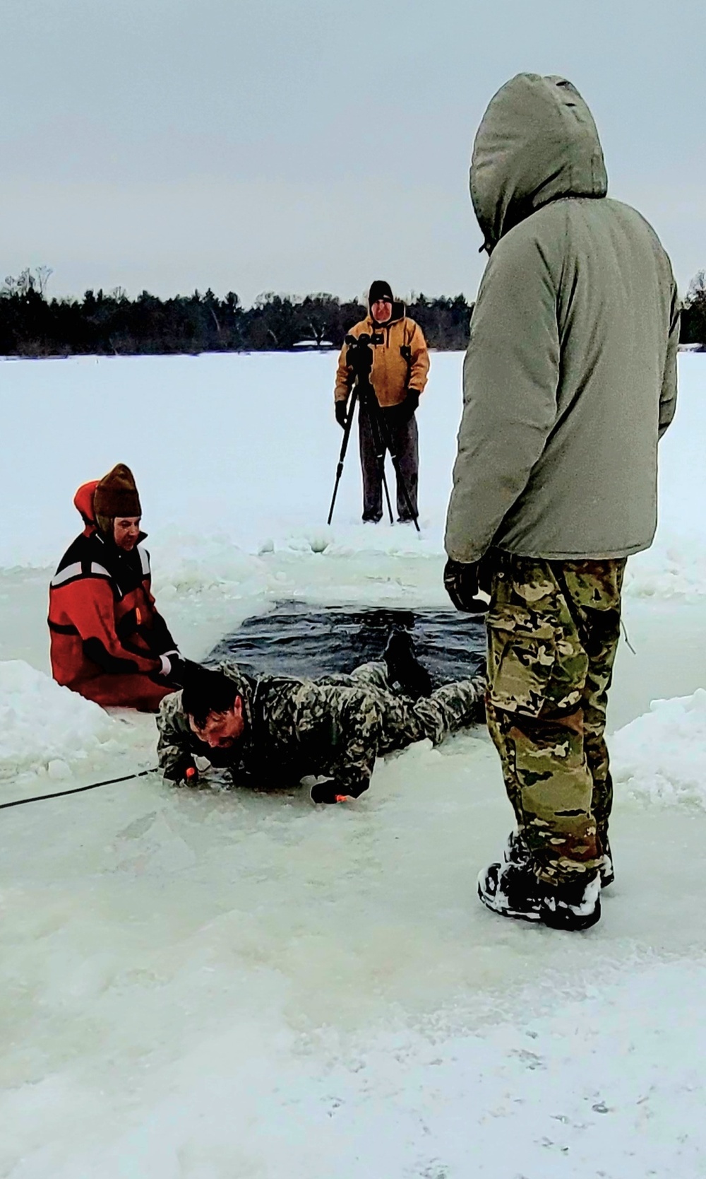 Airmen jump in for cold-water immersion training as part of Air Force-led Cold-Weather Operations Course at Fort McCoy