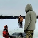 Airmen jump in for cold-water immersion training as part of Air Force-led Cold-Weather Operations Course at Fort McCoy