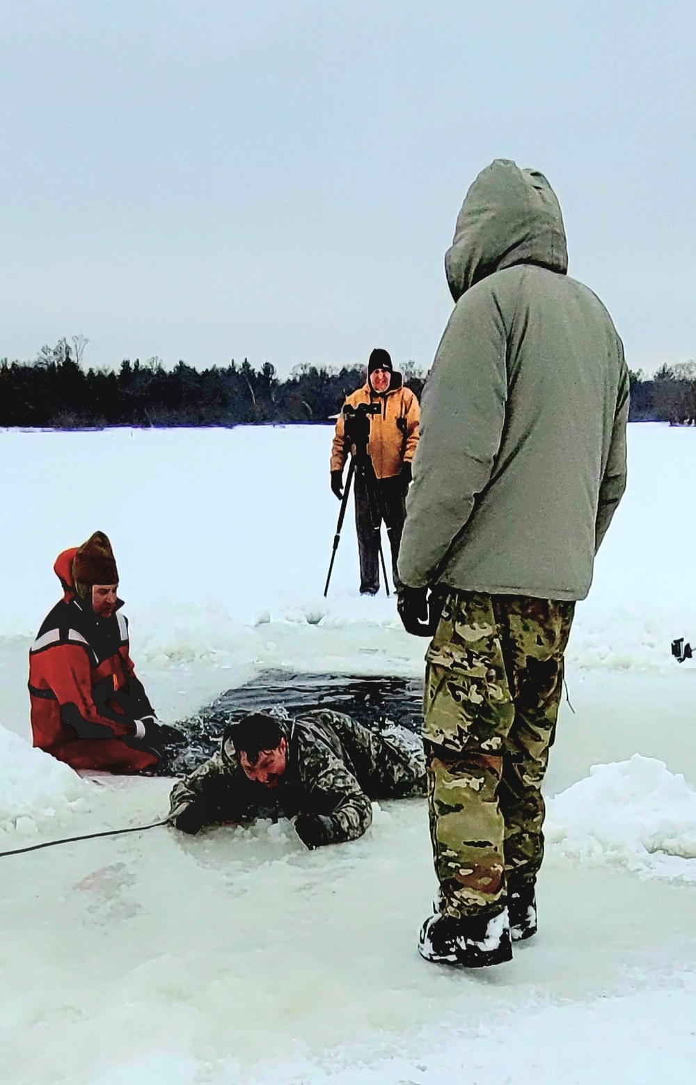 Airmen jump in for cold-water immersion training as part of Air Force-led Cold-Weather Operations Course at Fort McCoy