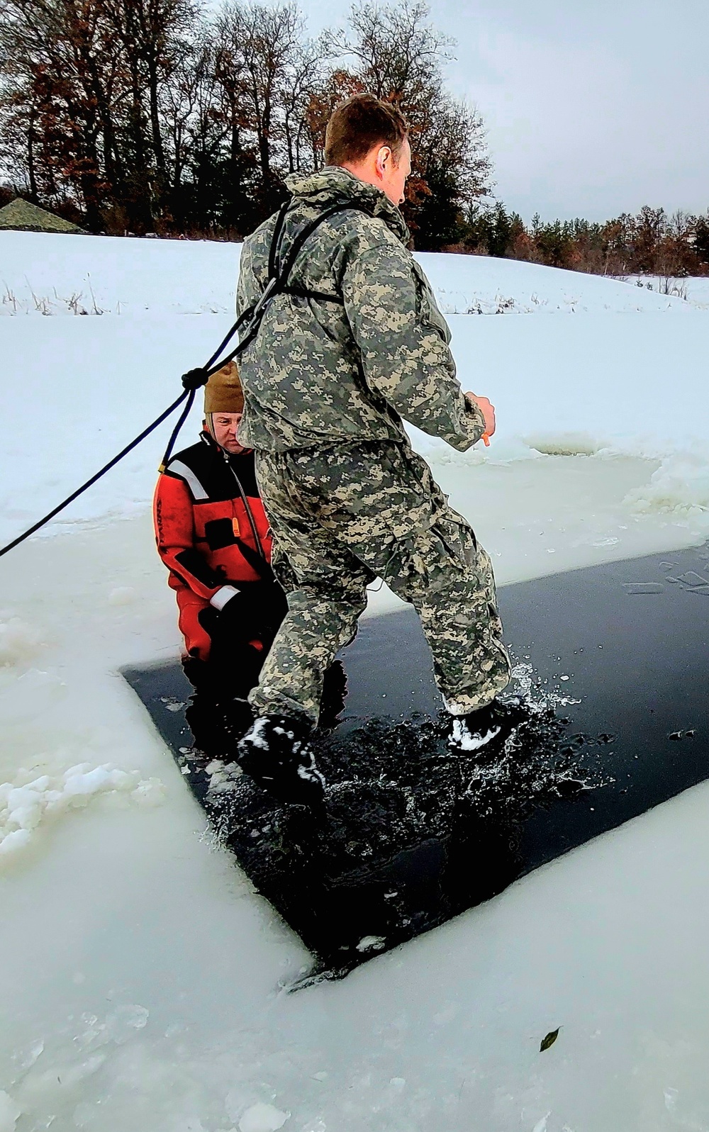 Airmen jump in for cold-water immersion training as part of Air Force-led Cold-Weather Operations Course at Fort McCoy