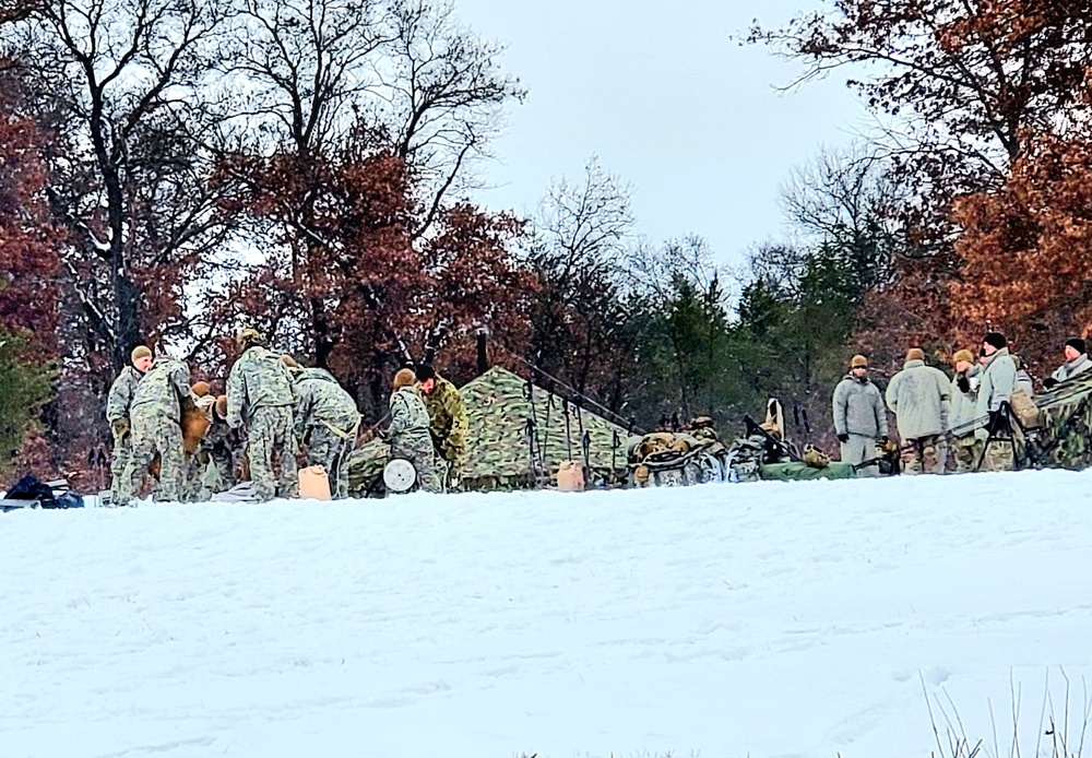 Airmen learn to build Arctic 10-person tents during cold-weather training at Fort McCoy