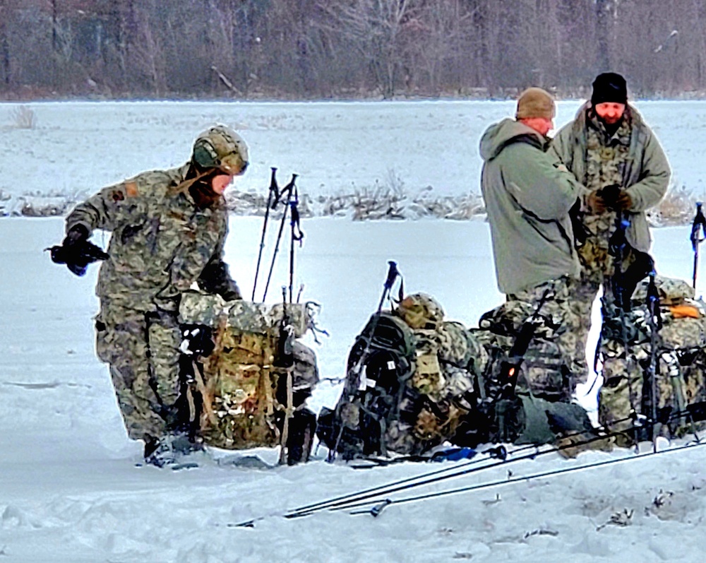 Airmen learn to build Arctic 10-person tents during cold-weather training at Fort McCoy