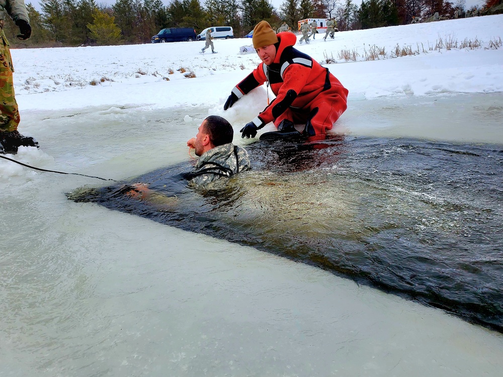 Airmen jump in for cold-water immersion training as part of Air Force-led Cold-Weather Operations Course at Fort McCoy