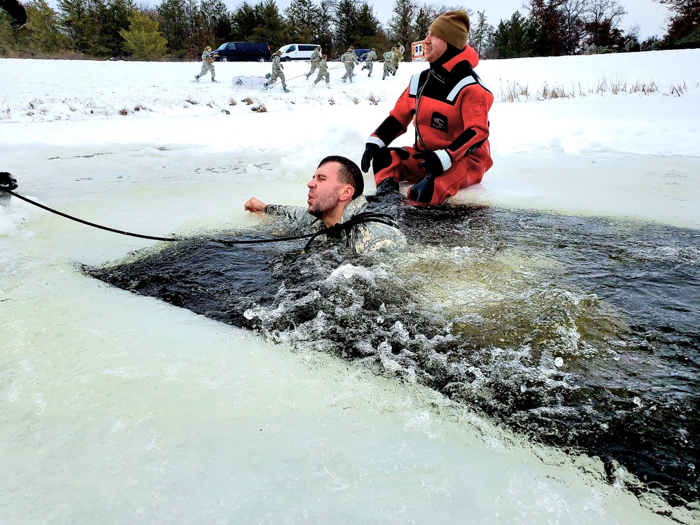 Airmen jump in for cold-water immersion training as part of Air Force-led Cold-Weather Operations Course at Fort McCoy