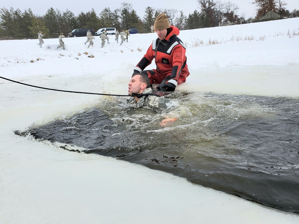 Airmen jump in for cold-water immersion training as part of Air Force-led Cold-Weather Operations Course at Fort McCoy