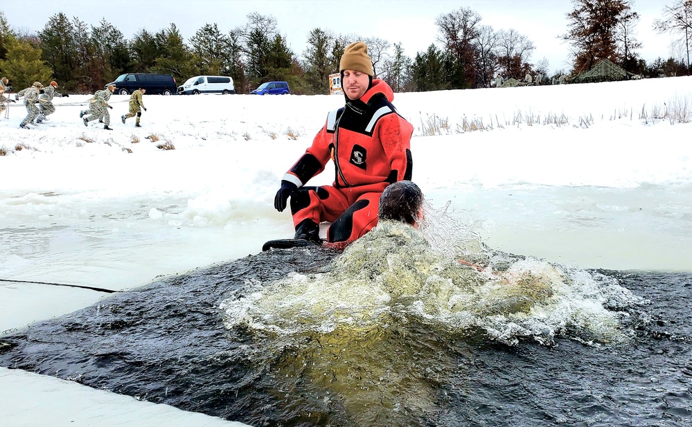 Airmen jump in for cold-water immersion training as part of Air Force-led Cold-Weather Operations Course at Fort McCoy