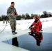 Airmen jump in for cold-water immersion training as part of Air Force-led Cold-Weather Operations Course at Fort McCoy