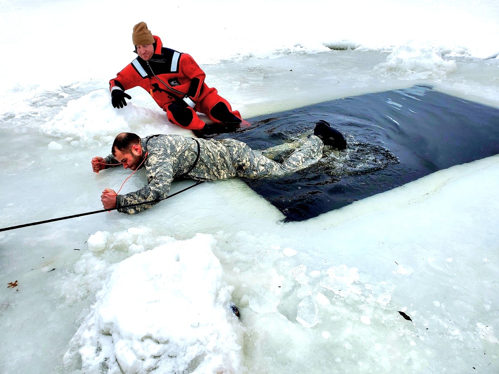 Airmen jump in for cold-water immersion training as part of Air Force-led Cold-Weather Operations Course at Fort McCoy