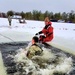 Airmen jump in for cold-water immersion training as part of Air Force-led Cold-Weather Operations Course at Fort McCoy