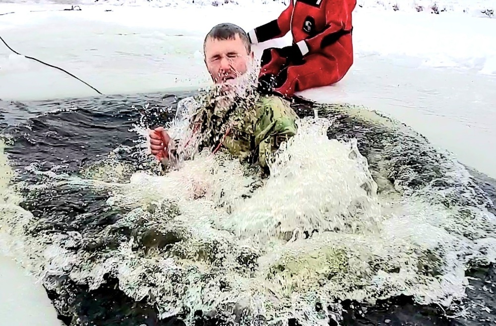 Airmen jump in for cold-water immersion training as part of Air Force-led Cold-Weather Operations Course at Fort McCoy