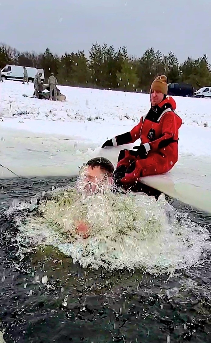 Airmen jump in for cold-water immersion training as part of Air Force-led Cold-Weather Operations Course at Fort McCoy