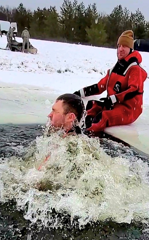 Airmen jump in for cold-water immersion training as part of Air Force-led Cold-Weather Operations Course at Fort McCoy